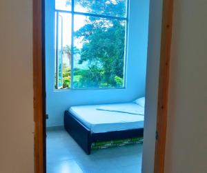 Ένα ή περισσότερα κρεβάτια σε δωμάτιο στο Finca el pariso-Turismo verde J&N