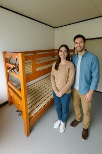 Postel nebo postele na pokoji v ubytování さんこ戸建て1号棟 + 17 fotografií