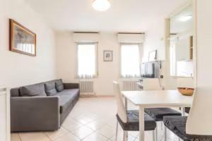 a living room with a couch and a table at Patty Sweet Home, Cattolica Centro in Cattolica +19 photos