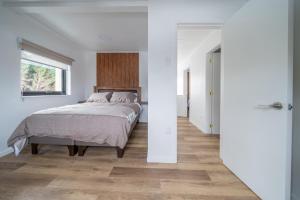 Ένα ή περισσότερα κρεβάτια σε δωμάτιο στο Millabú Hospedaje +39 φωτογραφίες