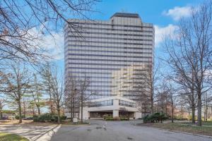 a tall building with a lot of windows at World of Blue 711 I Beautiful King Hotel Room in Secaucus