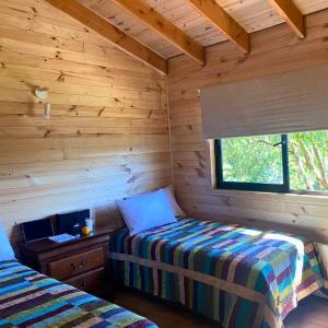 Ένα ή περισσότερα κρεβάτια σε δωμάτιο στο Casa Pullinque en Panguipulli