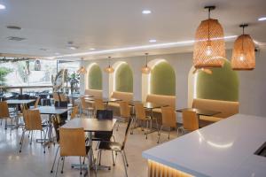 Restoran või mõni muu söögikoht majutusasutuses Hotel Portón Sabaneta