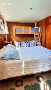 En eller flere senge i et værelse på Casa Montemira