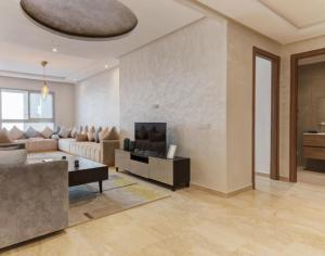 TV a/nebo společenská místnost v ubytování slimane