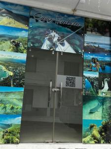 a glass door with a movie poster on the wall at La Isla Del Descanso in Puerto Villamil