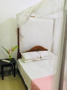 Ένα ή περισσότερα κρεβάτια σε δωμάτιο στο The Moon Star Vila