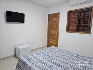 TV a/nebo společenská místnost v ubytování Flor de Jagube Guest House