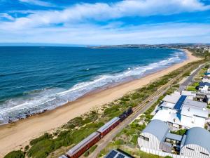a train on the beach next to the ocean at Pet Friendly in Port Elliot in Port Elliot
