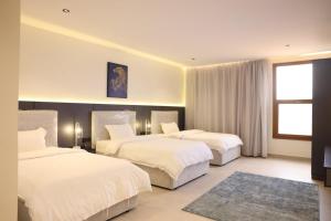 Ένα ή περισσότερα κρεβάτια σε δωμάτιο στο Jood Alula Apartment