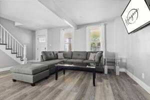 a living room with a couch and a coffee table at 4BR Niagara Falls Home Free Parking WiFi in Niagara Falls