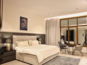 Ένα ή περισσότερα κρεβάτια σε δωμάτιο στο Jood Alula Apartment +8 φωτογραφίες