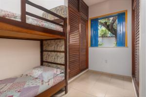 En eller flere senge i et værelse på Casa Praia do Forte