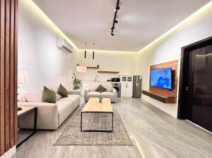 Μια τηλεόραση ή/και κέντρο ψυχαγωγίας στο Jood Alula Apartment