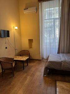 Ένα ή περισσότερα κρεβάτια σε δωμάτιο στο Lucky Hostel