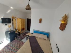 a room with a bed and a tv in it at camp caesar in Dahab