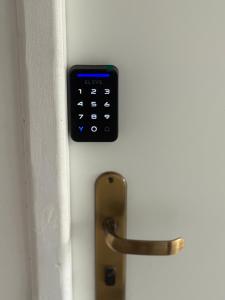 a door with a remote control attached to it at Apartamento Bela Vista in Canoinhas