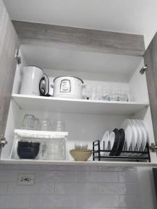 Kuchyň nebo kuchyňský kout v ubytování Vistaro Stays at Fame Residences