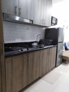 Kuchyň nebo kuchyňský kout v ubytování Vistaro Stays at Fame Residences + 3 fotografie