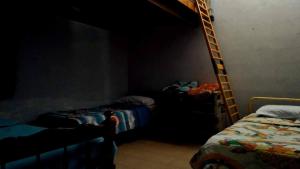 En eller flere senge i et værelse på Casa colibrí