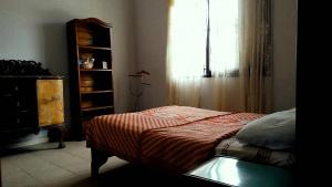 En eller flere senge i et værelse på Casa colibrí