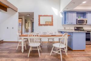 a kitchen and dining room with a table and chairs at Waldport Serenity in Waldport +35 photos
