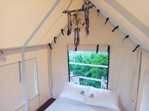 Una cama o camas en una habitación de Cabaña tipi Ardilla Silvania Cundinamarca
