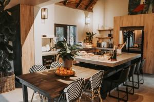a kitchen with a table with a bowl of fruit on it at Wildlife Estate Villa - Pool - Boma - Bushlife in Hoedspruit