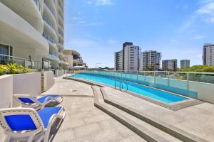 a swimming pool on the roof of a building at Poolside Bliss in Maroochydore