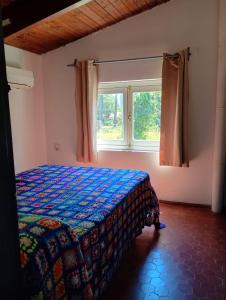 Postel nebo postele na pokoji v ubytování Casa con pileta