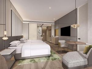 Postel nebo postele na pokoji v ubytování Doubletree By Hilton Zhengzhou Airport Aerotropolis