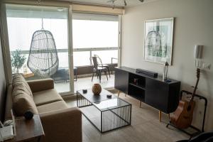 Гостиная зона в Exclusivo departamento con vista al mar