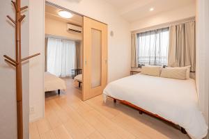 Ένα ή περισσότερα κρεβάτια σε δωμάτιο στο Louis stage asakusa