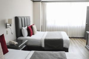 Postel nebo postele na pokoji v ubytování Hotel Santander Plaza + 18 fotografií