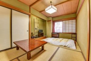 Ένα ή περισσότερα κρεβάτια σε δωμάτιο στο Town Hotel Nakaya +8 φωτογραφίες