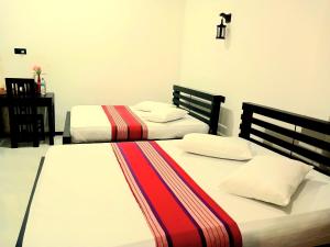 Ένα ή περισσότερα κρεβάτια σε δωμάτιο στο Yala Thaman +9 φωτογραφίες