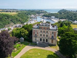 an aerial view of a large house with a river at Mobil-home à Pordic 4 pers. avec Terrasse - API-1-52-1204 in Pordic