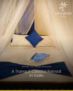 Ένα ή περισσότερα κρεβάτια σε δωμάτιο στο Coco Grove