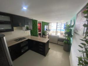 Una cocina o cocineta en Departamento frente al mar edificio Arena Plaza