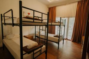 Ένα ή περισσότερα κρεβάτια σε δωμάτιο στο Mojosurf Red Island