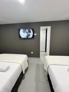 Ένα ή περισσότερα κρεβάτια σε δωμάτιο στο Duitama Loft +6 φωτογραφίες