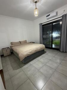 Ένα ή περισσότερα κρεβάτια σε δωμάτιο στο Ponta Rest House