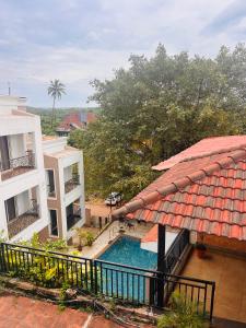 a view of a pool from the balcony of a hotel at Marvella Stays in Anjuna