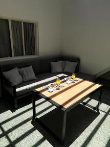 a living room with a table and a couch at The Marseille Oasis in La Porteña