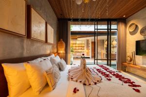 Ένα ή περισσότερα κρεβάτια σε δωμάτιο στο Danu Villas Bali