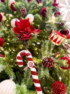a christmas tree with a red and white candy cane at PHUC LONG LUXURY Danang in Da Nang