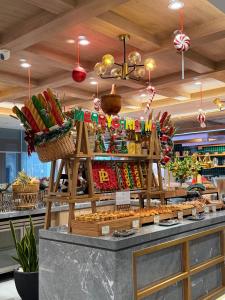 a store counter with a display of food at PHUC LONG LUXURY Danang in Da Nang +59 photos