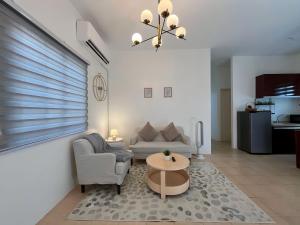 a living room with a couch and a table at Best Inn - Bohol 1407 in Dauis