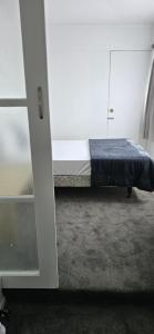 Ένα ή περισσότερα κρεβάτια σε δωμάτιο στο Baden Lodge Motel - PRIVATE SPA Bath