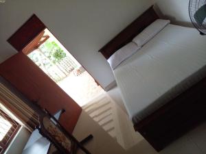 Una cama o camas en una habitación de Muthu Villa